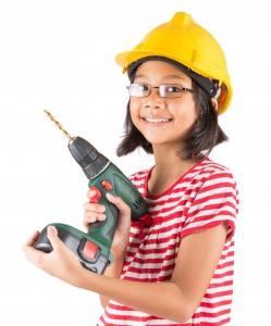 Little asian malay girl with power drill over white background